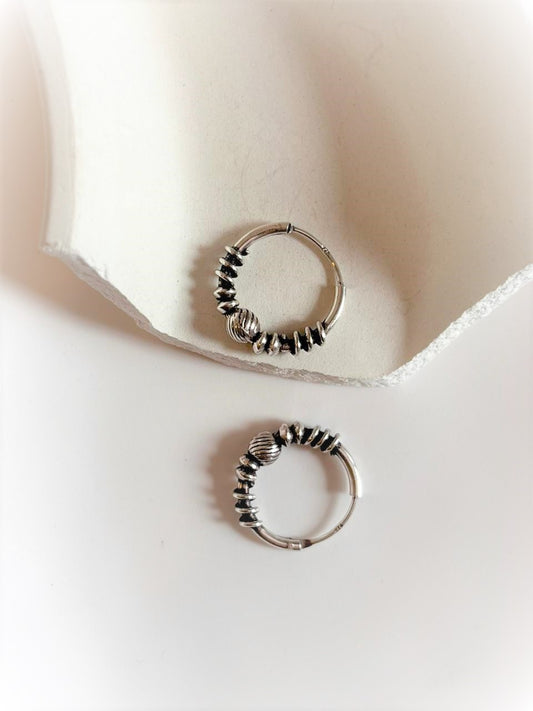 Elegant antique silver hoop earrings with intricate design 5.
