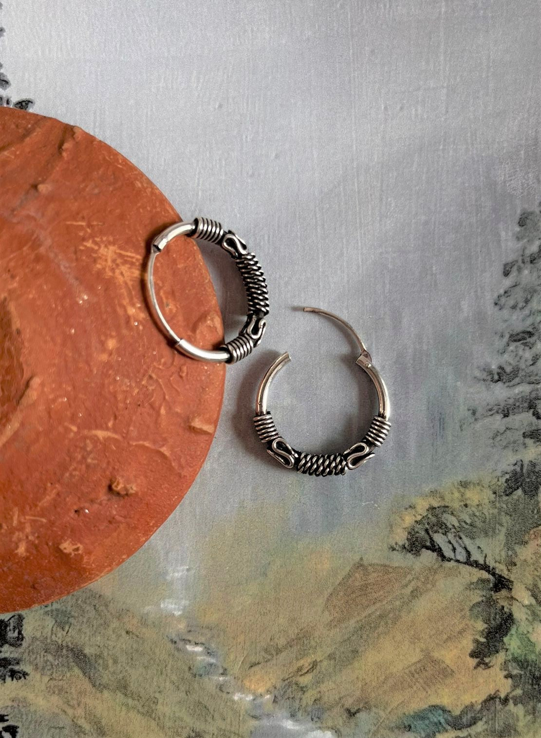Handcrafted antique silver hoop earrings with exquisite design 7.