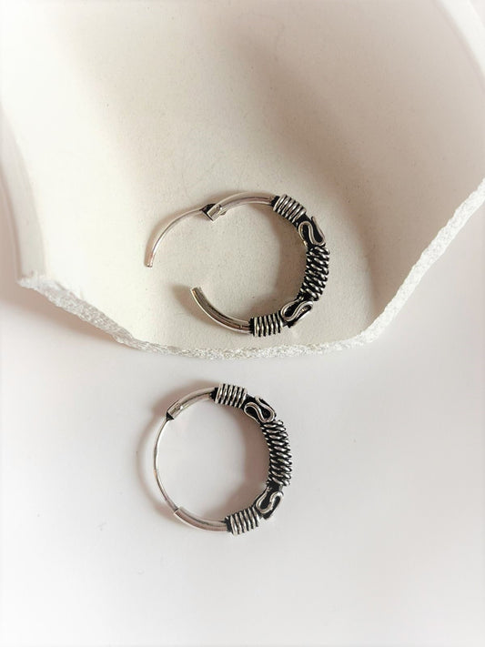 Elegant antique silver hoop earrings with intricate design 7.