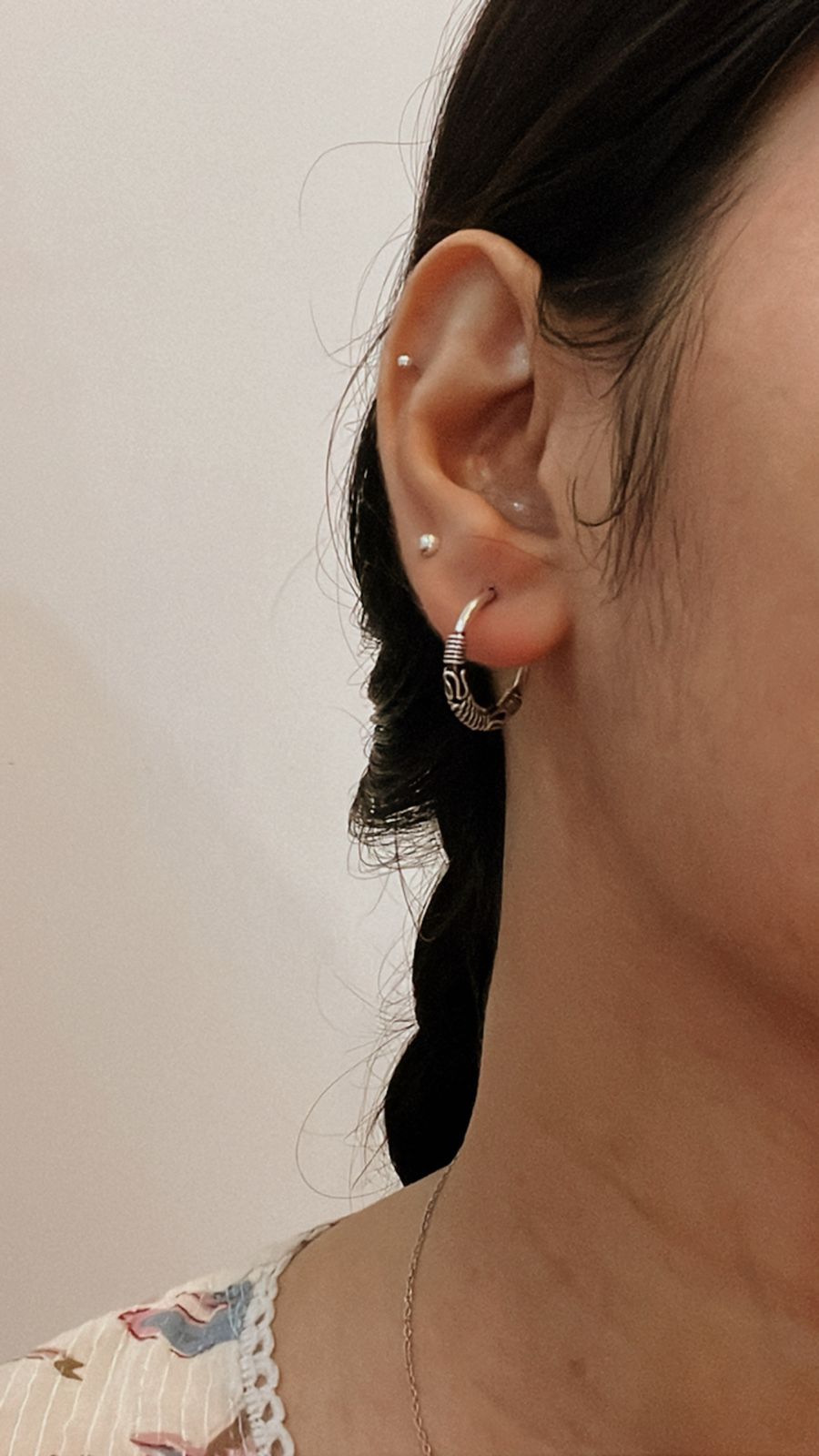 Vintage-inspired silver hoops featuring a detailed design 7.