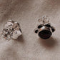Exquisite black onyx flower studs set in sterling silver for a bold look.