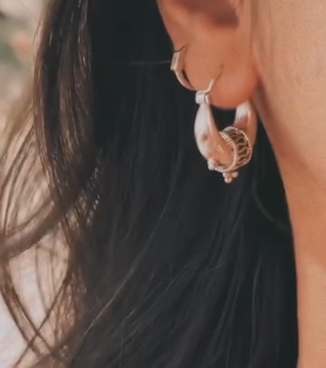 Vintage-inspired large dolki silver hoops with tribal detailing.