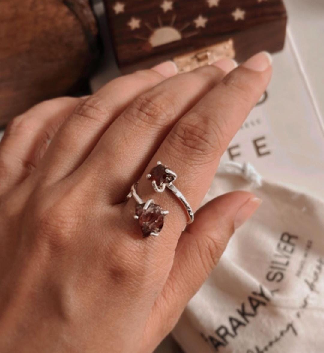 Silver ring featuring double raw uncut garnet stones and adjustable fit