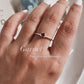 Classic silver ring featuring a single garnet gemstone