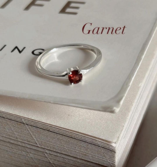 Timeless garnet solitaire ring with a sleek 925 Sterling Silver band