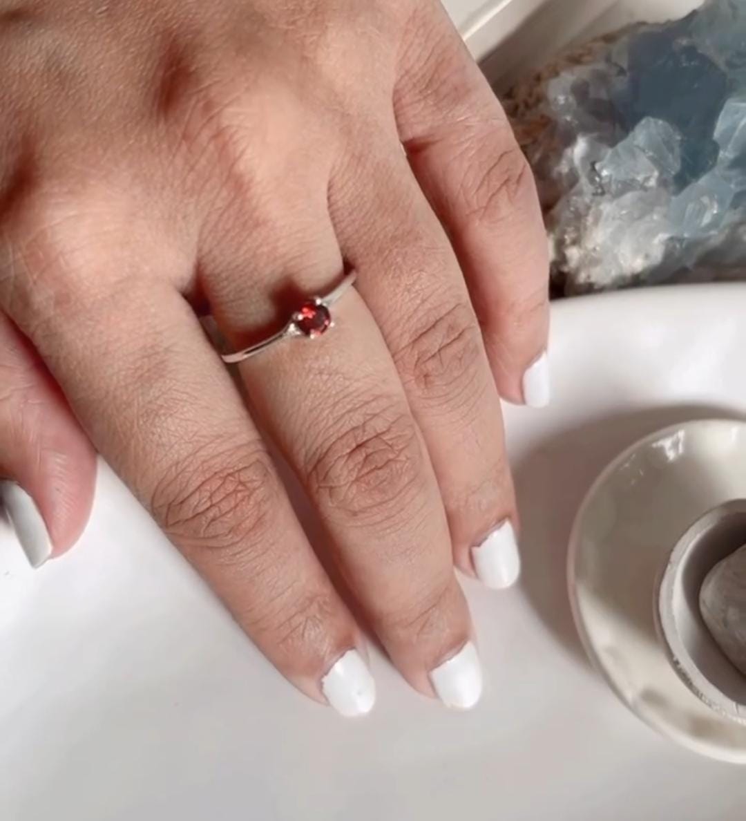 Simple and elegant silver ring with a garnet solitaire stone