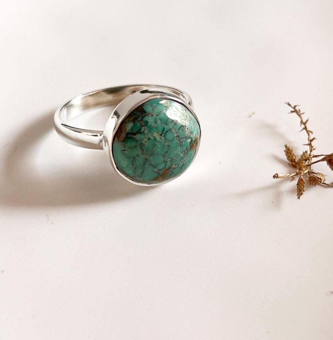 Elegant big Tibet turquoise ring in sterling silver for a bold look.
