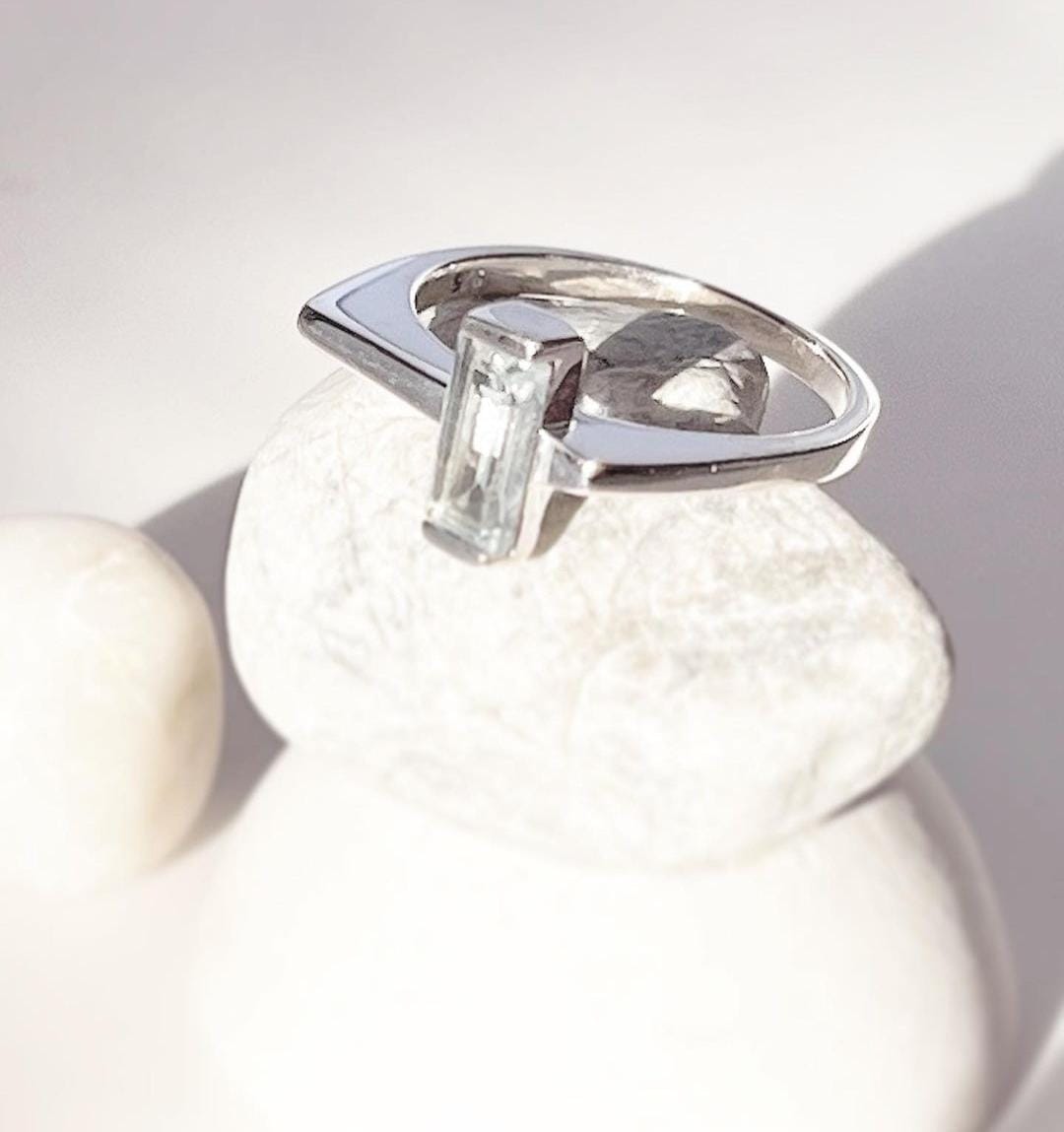 Chic Blue Topaz Silver Ring with Side Stone Details