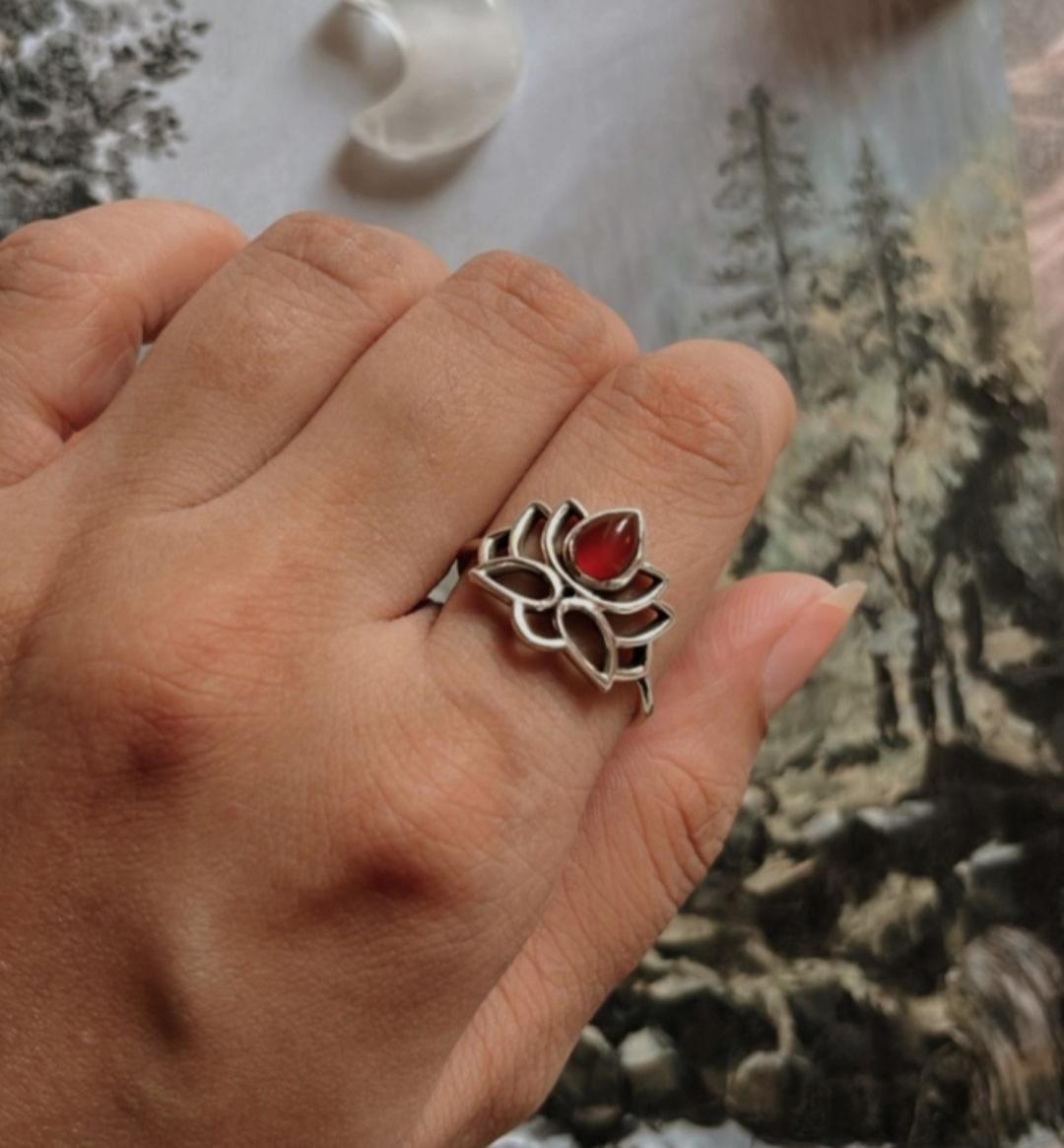 Close-up of carnelian gemstone set in Divine Lotus silver ring