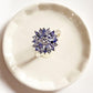 Trendy tanzanite flower ring with bold silver band