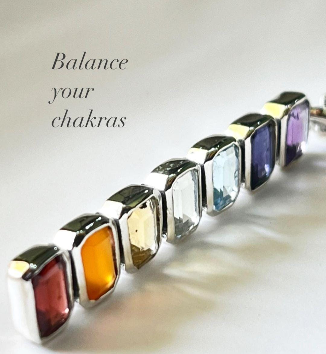 Handcrafted silver pendant with rectangular chakra gemstones
