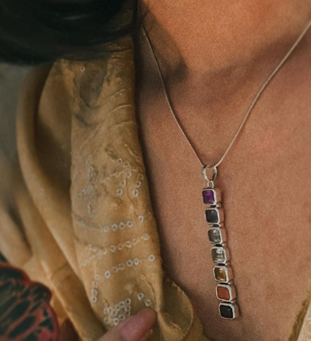 Vibrant seven chakra stones in rectangular cut silver pendant