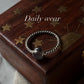 Elegant rose quartz silver ring with rope-style band