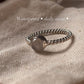 Delicate rose quartz silver ring with twisted rope detailing