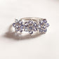 Elegant tanzanite three flower ring in sterling silver