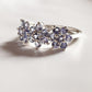 Stylish tanzanite silver ring with three flower motif