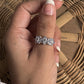 Handcrafted tanzanite three flower ring in sterling silver