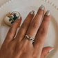 Elegant silver ring with wave motif design