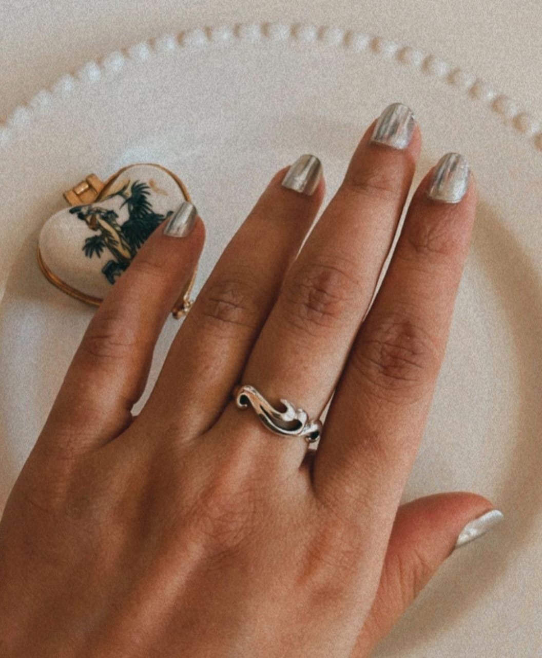 Elegant silver ring with wave motif design