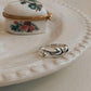 Sterling silver ring featuring wave pattern