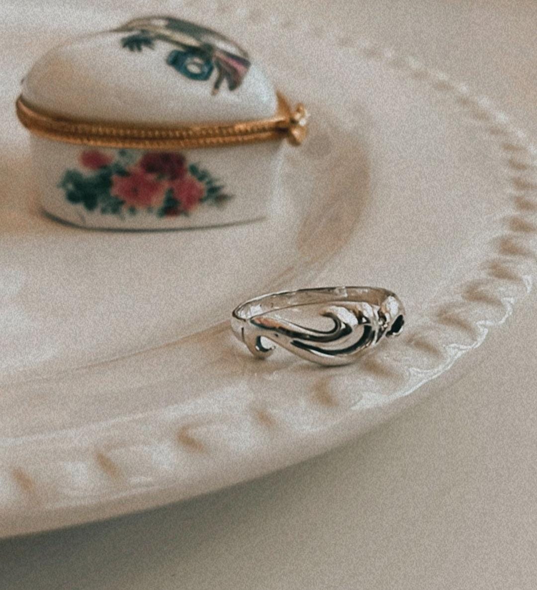 Sterling silver ring featuring wave pattern