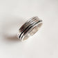 Charming hammered spinner ring in polished silver
