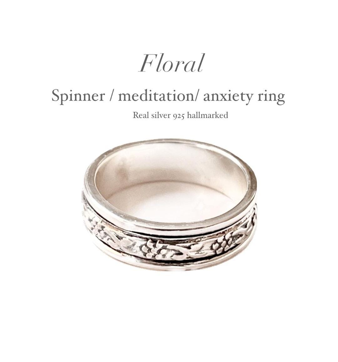 Elegant floral spinner silver ring with intricate flower designs