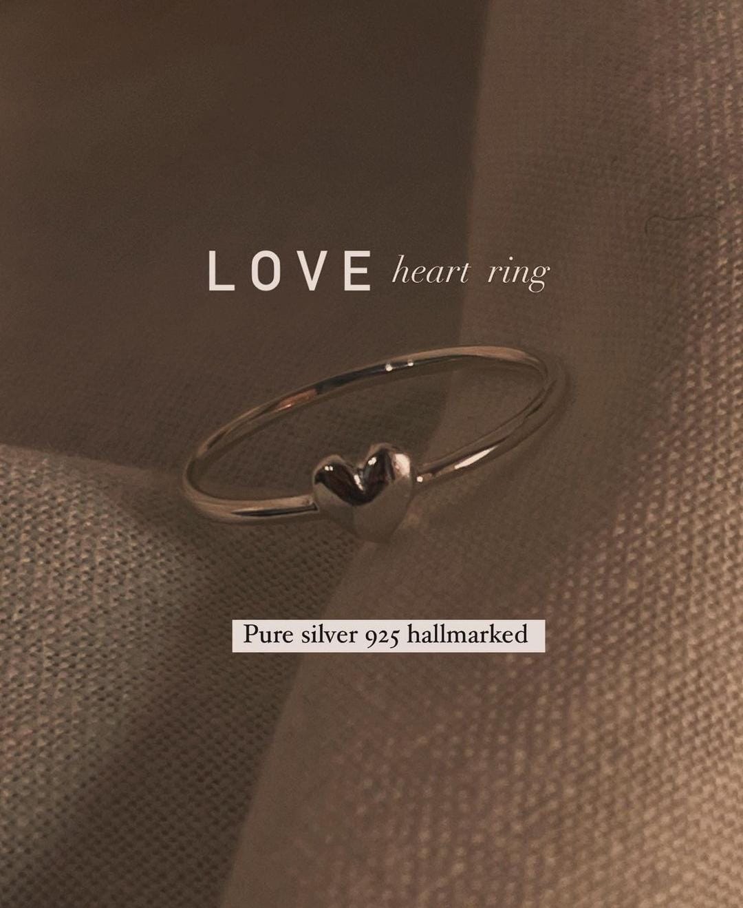 Delicate sterling silver ring with heart motif