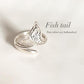 Timeless fish tail silver ring with a flowing, curved shape