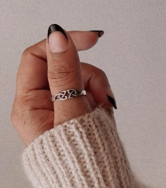 Handcrafted silver ring featuring Celtic knot details