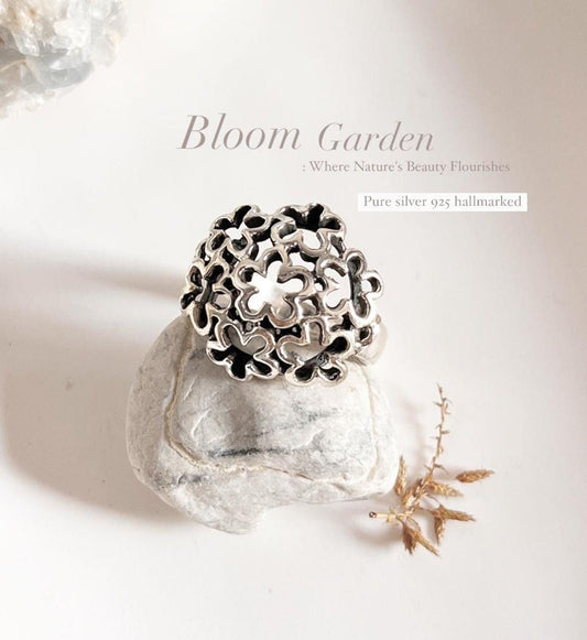 Chunky floral silver ring with intricate flower design