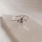 Sleek and bold silver ring with a large bee motif.