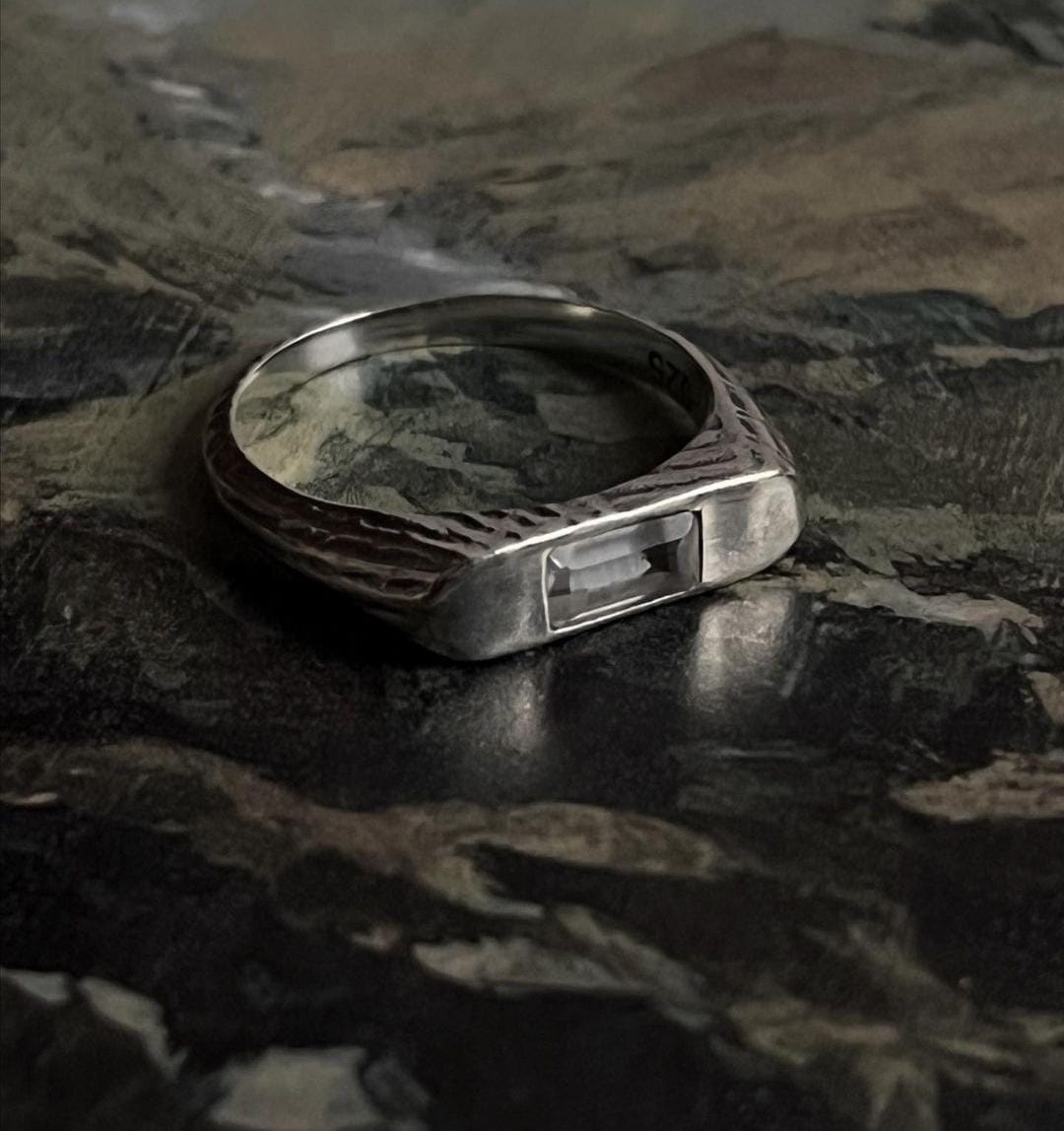 Elegant signet ring featuring a clear quartz gemstone in silver