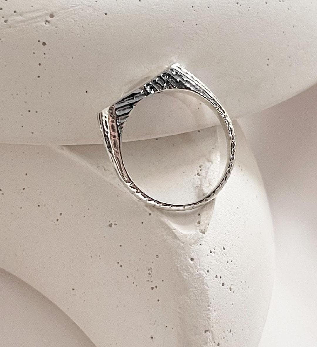 Clear quartz stone featured in a refined signet silver ring