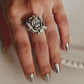 Elegant chunky silver ring with a detailed rose accent