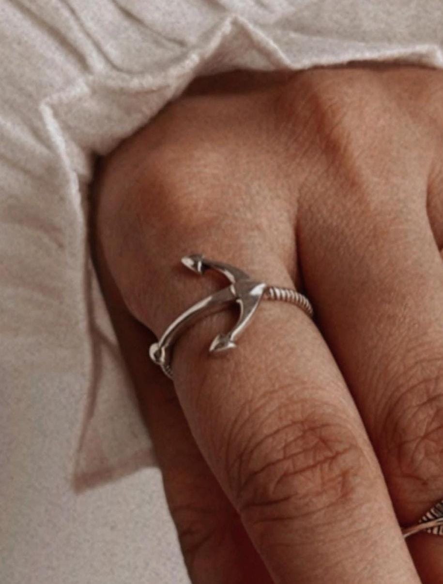 Elegant silver ring with a bold anchor symbol.