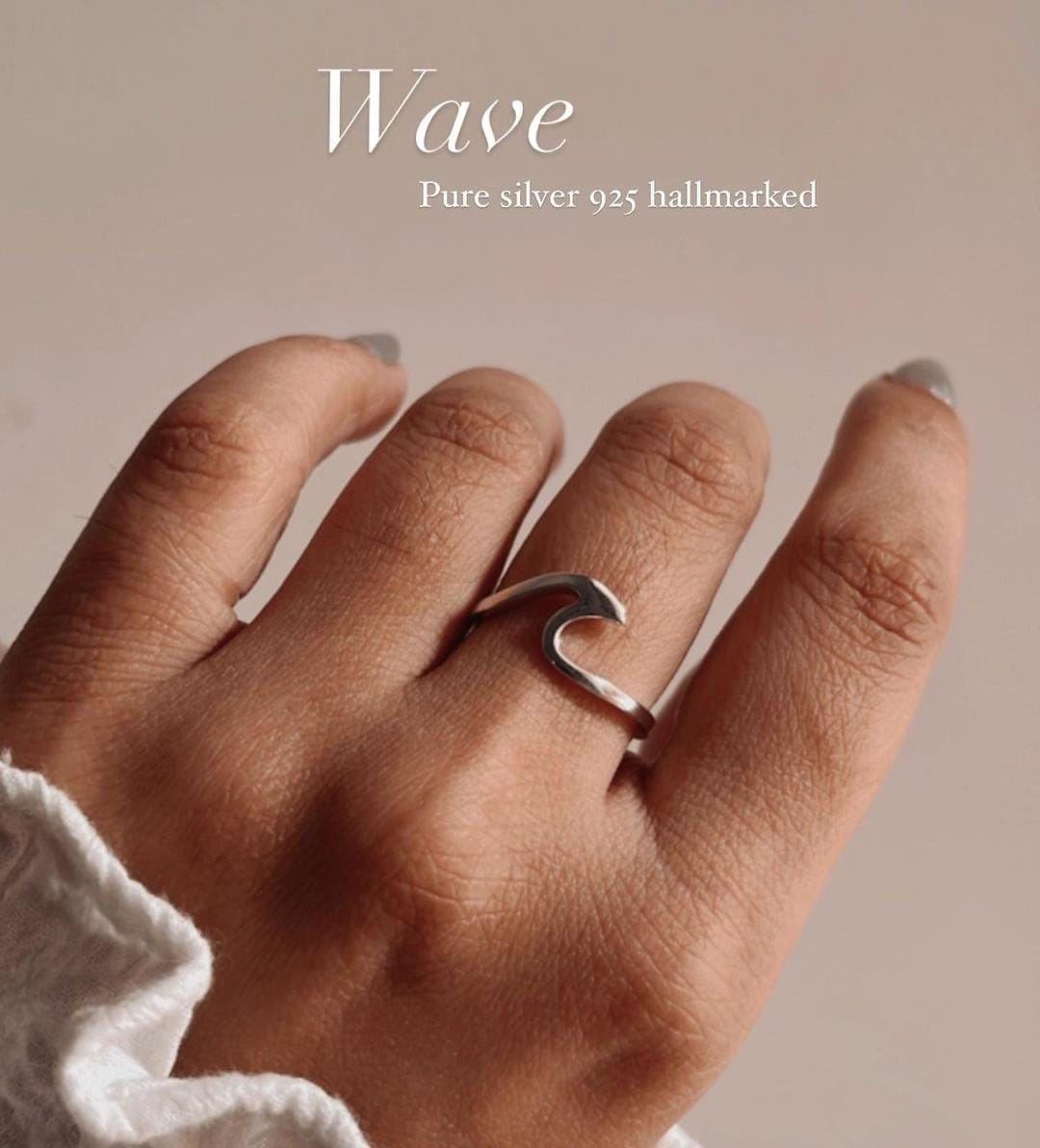 Sleek wave-shaped silver ring
