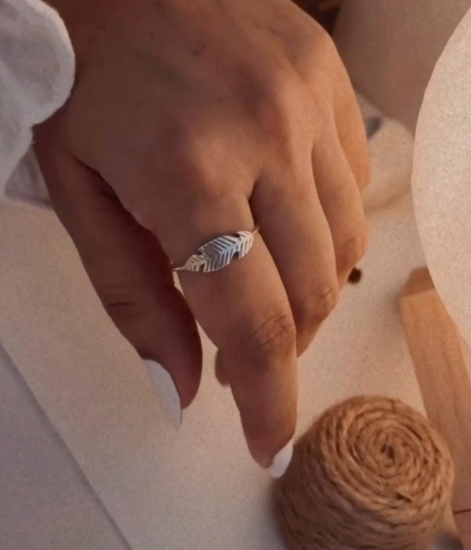 Delicate sterling silver ring with feather motif