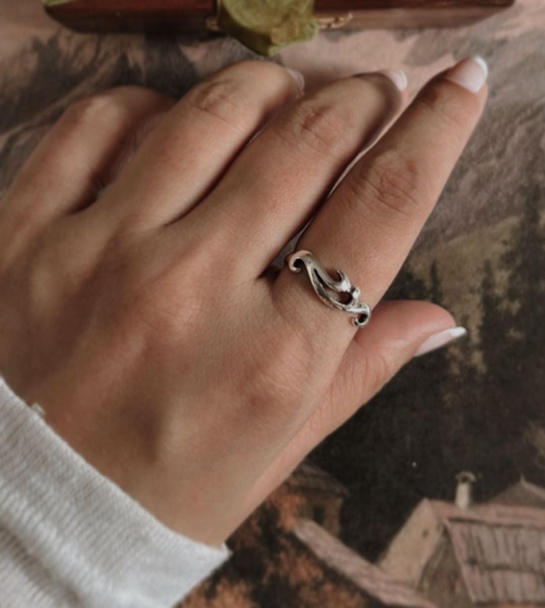 Elegant silver ring with wave motif design