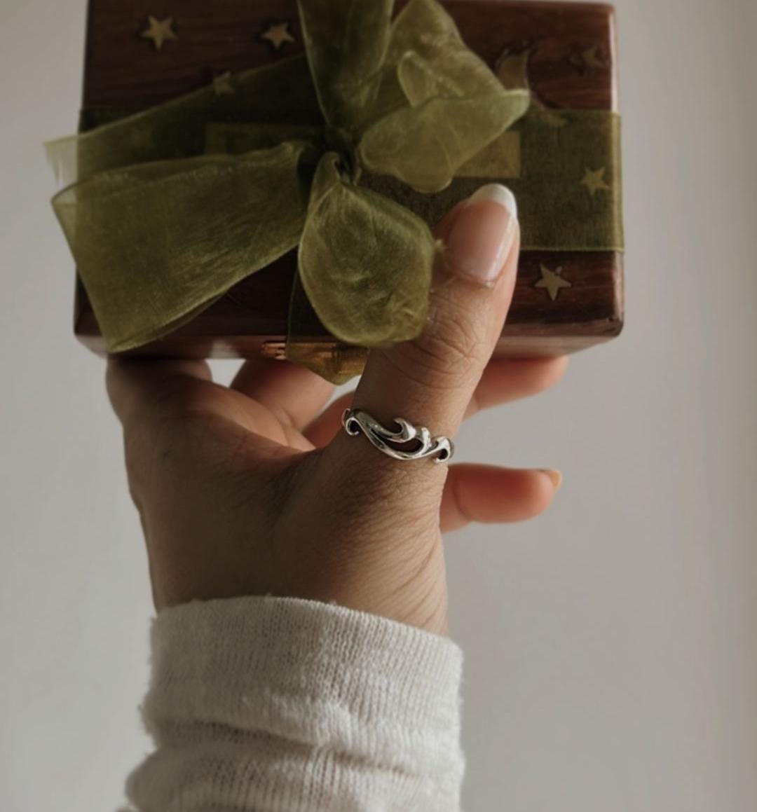 Sterling silver ring featuring wave pattern