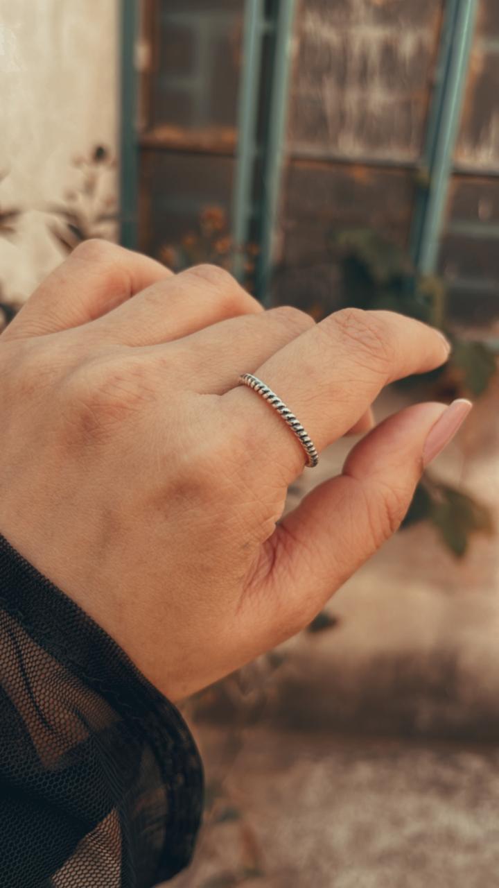 Polished silver rope band ring designed for stackable looks