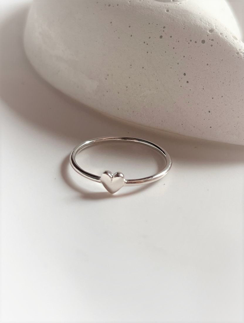 Small heart-shaped silver ring design