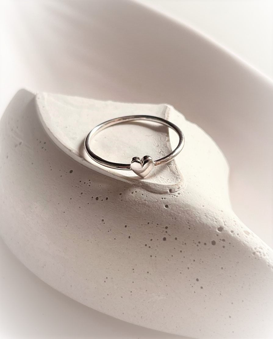 Charming silver ring featuring a small heart