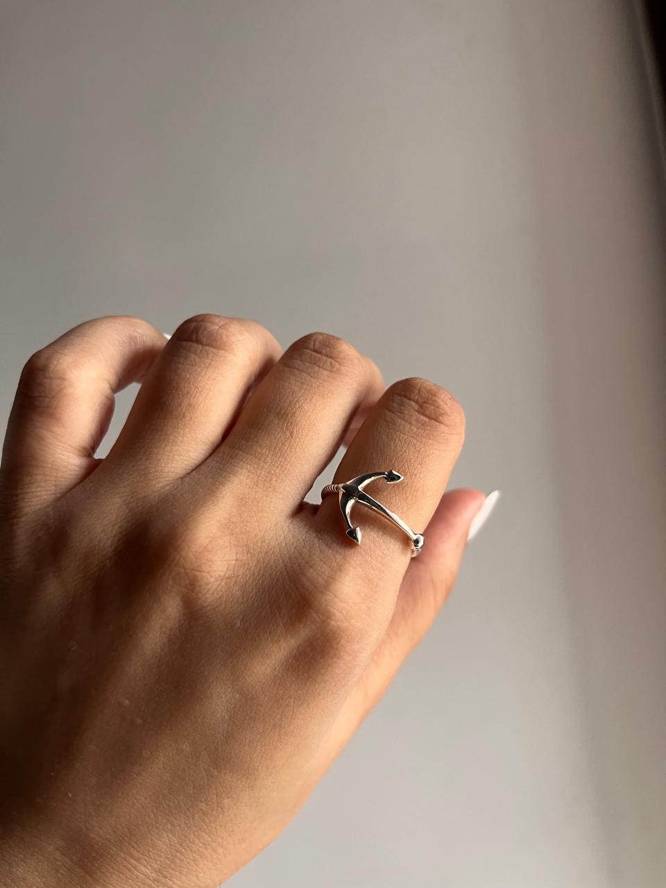 Timeless silver ring with a detailed anchor motif.