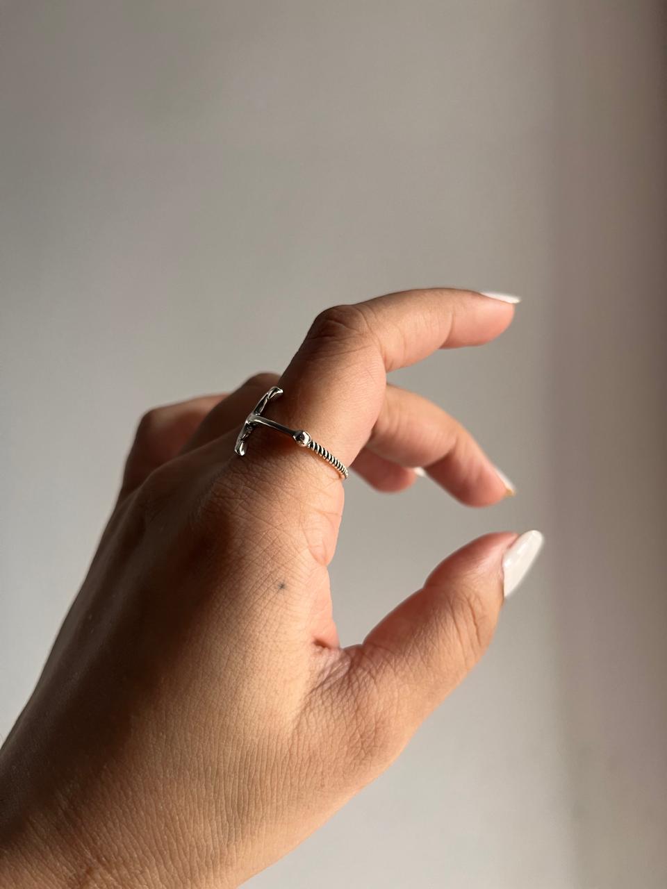 Sophisticated silver ring with an anchor symbol for a nautical touch.