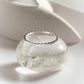 Timeless silver 925 stackable ring featuring a subtle dot band design
