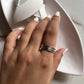 Sophisticated floral spinner silver ring with a smooth, polished finish