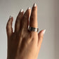 Sterling silver ring with hammered texture and spinning feature