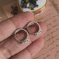 Delicate silver huggie earrings featuring opal gemstone
