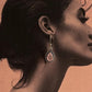 Bohemian-inspired pear-cut rose quartz 925 sterling silver earrings with hook design